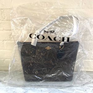 Signature Coach Bag, brand new still in packaging